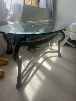 Oval Glass Top Coffee table with animal motif legs