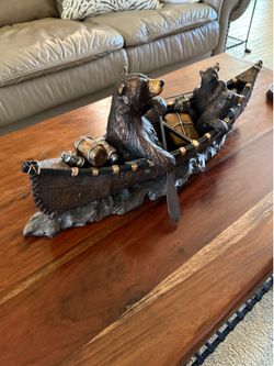Canoe with rowing bear