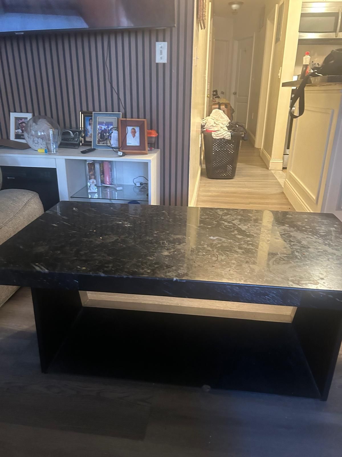 Enhance your dining space with this elegant black marble dining table. Its sleek design and luxurious finish make it a perfect centerpiece for any hom