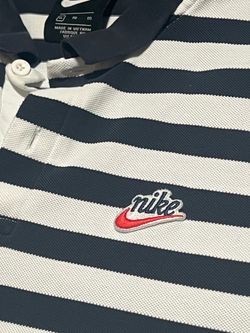 Nike short sleeve polo shirt. Navy blue and white horizontal stripes.