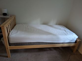 Twin bed - wooden frame, mattress, and cover