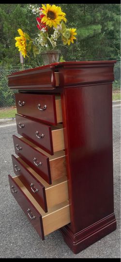 Real wood tall chest with big drawers. Drawers sliding smoothly . Delivery available
