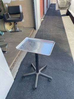 Adjuster tray with wheels
