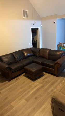 Two piece top grain leather sectional with ottoman