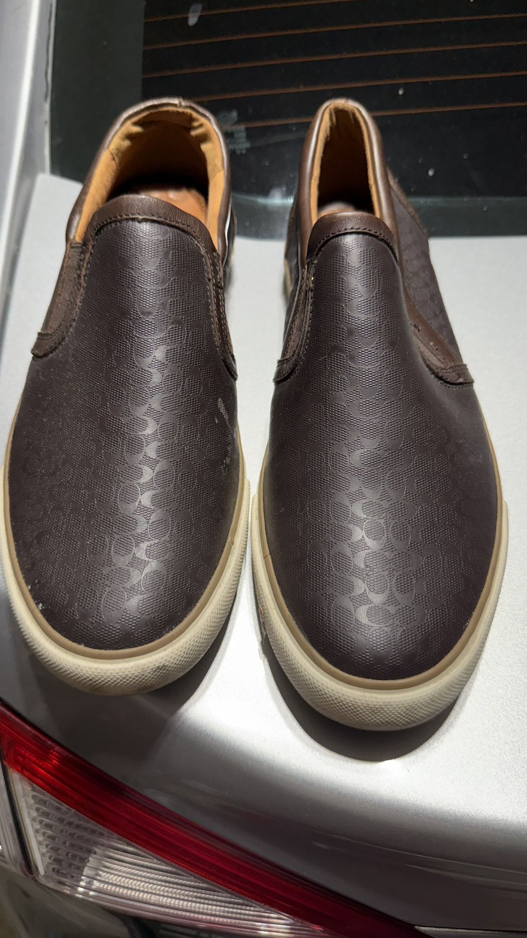 Brown Coach logo slip on tennis shoes
