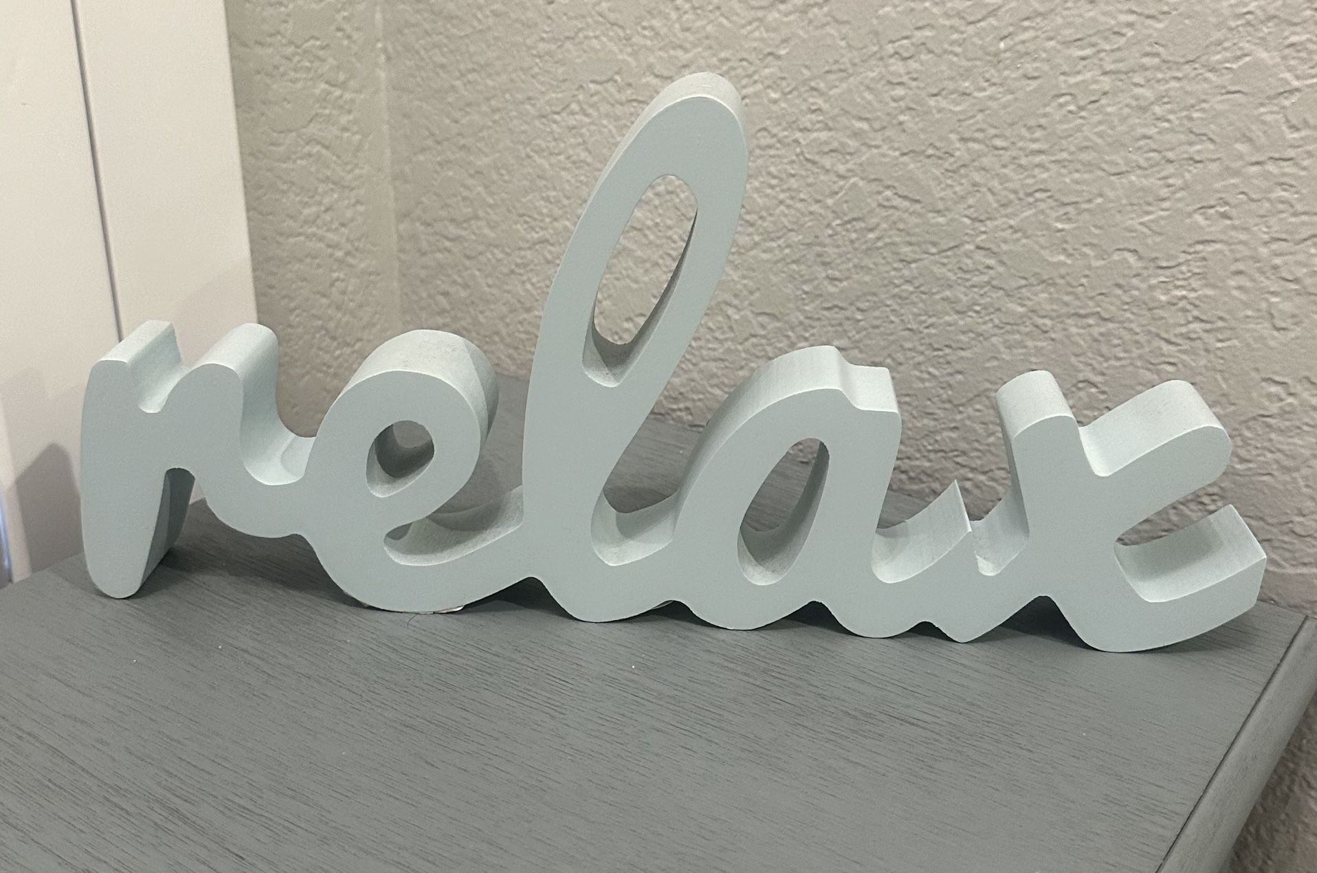 $10…New  Beach themed wooden decor “relax”, measures 14” long, 6.5” tall & 1.5” width. Please pickup in the area of 36th Ave and Pinnacle peak within 