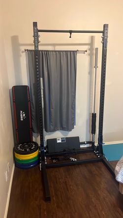 Squat rack with bars and weights