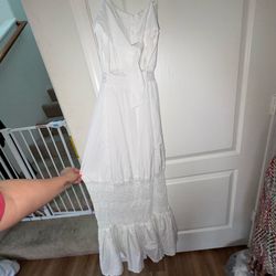 White maxi dress with lace trim and ruffled hem
