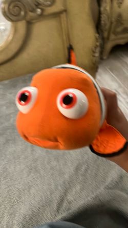 High-fiving Nemo plushy