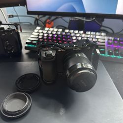 Sony a6700 + 50mm 1.8 lens + small rig cage