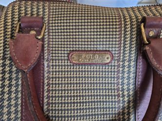 vintage Polo Ralph Lauren travel bag featuring a distinctive houndstooth pattern canvas and brown leather trim