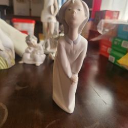 Lladro Young girl blowing a kiss porcelain