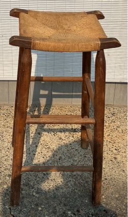 Wooden bar stool with rattan seat 30” tall.