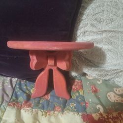 Small pink floating shelf with bow