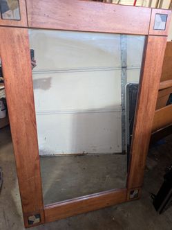 Mirror with stone inlay