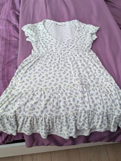 White dress with blue floral design