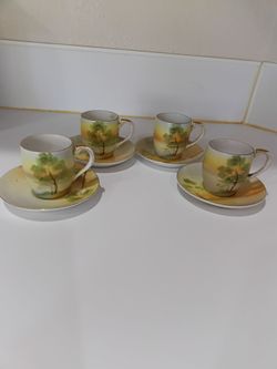 Hand painted miniature teacup set w/saucers