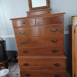 Ethan Allen  7 Drawer tall dresser.Solid Wood  Maple finish.  Separate Maple mirror with drawer.