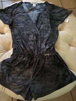 New black pattern romper.  Medium