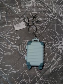 Suitcase hand sanitizer holder