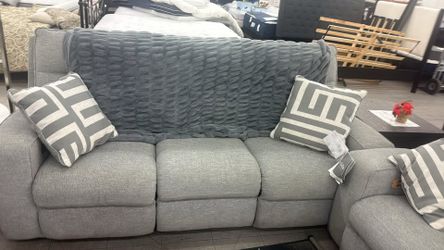 Ashley biscoe power reclining sofa loveseat set . whole set on display. great discount
