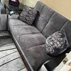 New. Grey couches with TV with the carpet only the couch just was 1900 everything 1500.