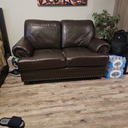 For Sale brown Faux Leather Loveseat