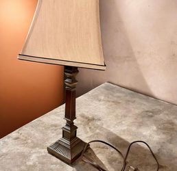 Traditional Neoclassical Corinthian Column Table Lamp featuring an antiqued bronze or dark resin style finish