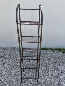 vintage brown metal arch-top plant stand