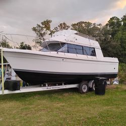 28'. Carver With Clean Title, Currently Registered Including Trailer