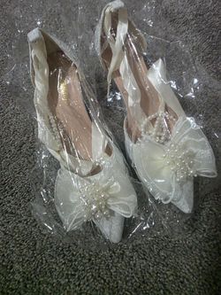 I have brand new, unworn white shoes, size