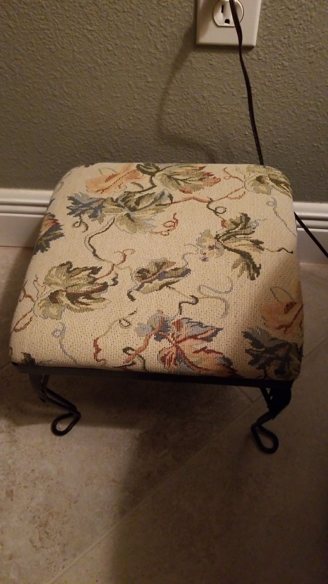 Antique foot stool with metal legs