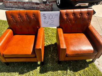 2  open Box new Leather chairs with side arms both for $100 Firm
