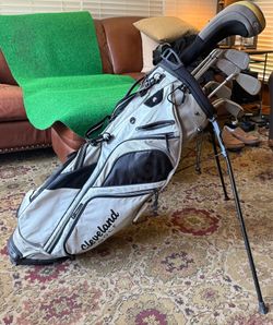 Callaway Big Bertha X-12 Irons 4-9, Taylormade R7 Quad Driver, Cleveland 3 Wood, 64 and 68 degree wedges & Cleveland golf stand bag