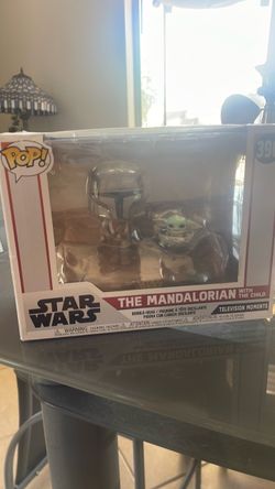 The Mandalorian with the child