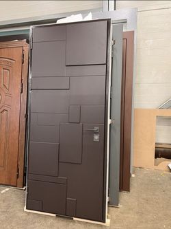 Modern Steel Entry Door with Geometric Panel Design
