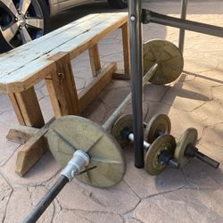 Weight bar, bench, and weights  two 25 lb weights , four 5lb weights, 3 total weight bars