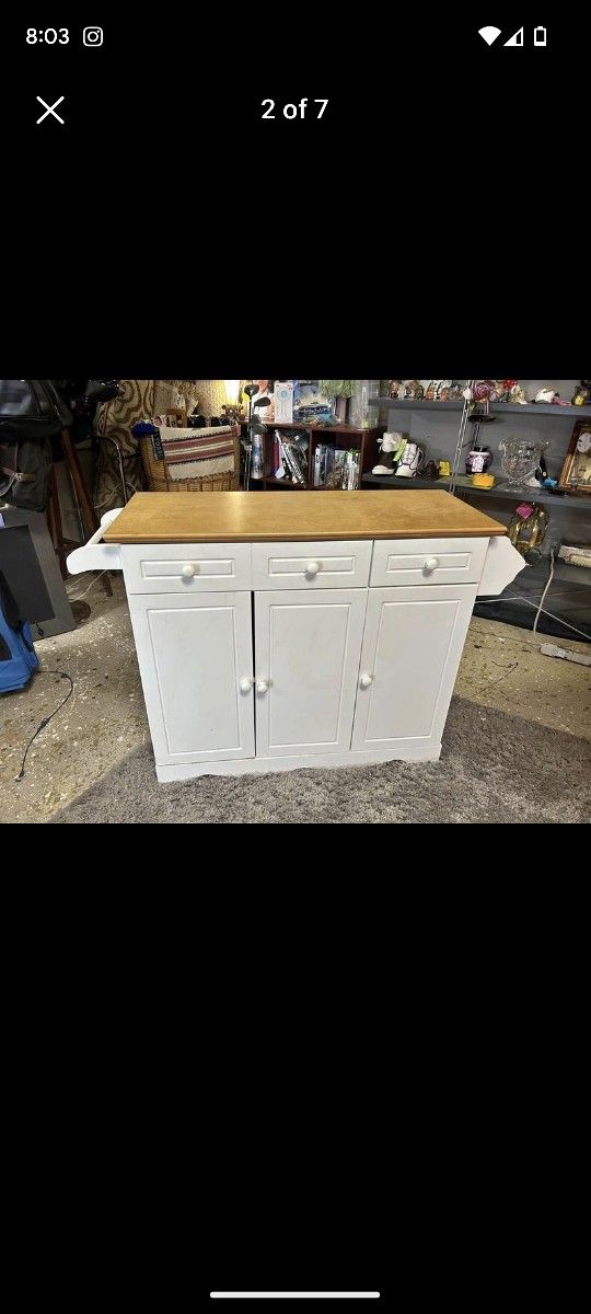 Kitchen island with towel racks on side. Smooth drawers.
37.5” 15” x 32”...