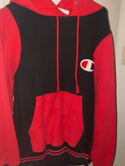 Champion Reverse Weave colorblock pullover hoodie in black and red with a "C" logo 