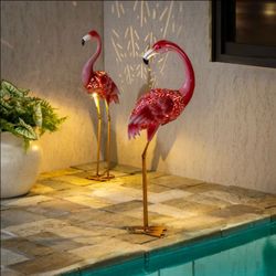 New in box Evergreen Enterprises
Solar LED Flamingo Pair, Set of 2. Costco $60
