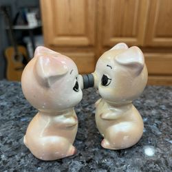 Vintage Napco Pig Magnetic Pair of Salt and Pepper Shakers.  Preowned.  Has been on display in a cabinet with a very large salt and pepper shakers col