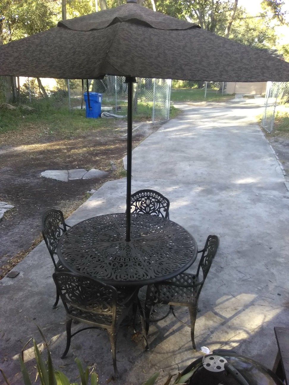 Patio set for $150 comes with the umbrella