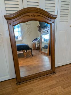 Arched wood framed mirror