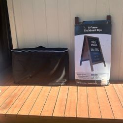 Massage Table And Chalkboard Sign 