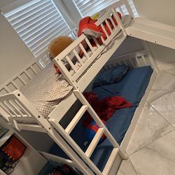 Bunk bed for sale with 2 mattresses included.