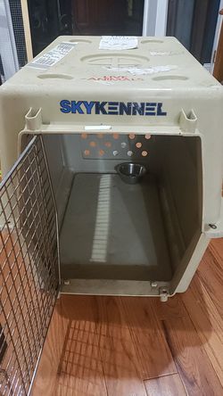 Dog kennel. Length 32 inch , 23 width and 23 high.