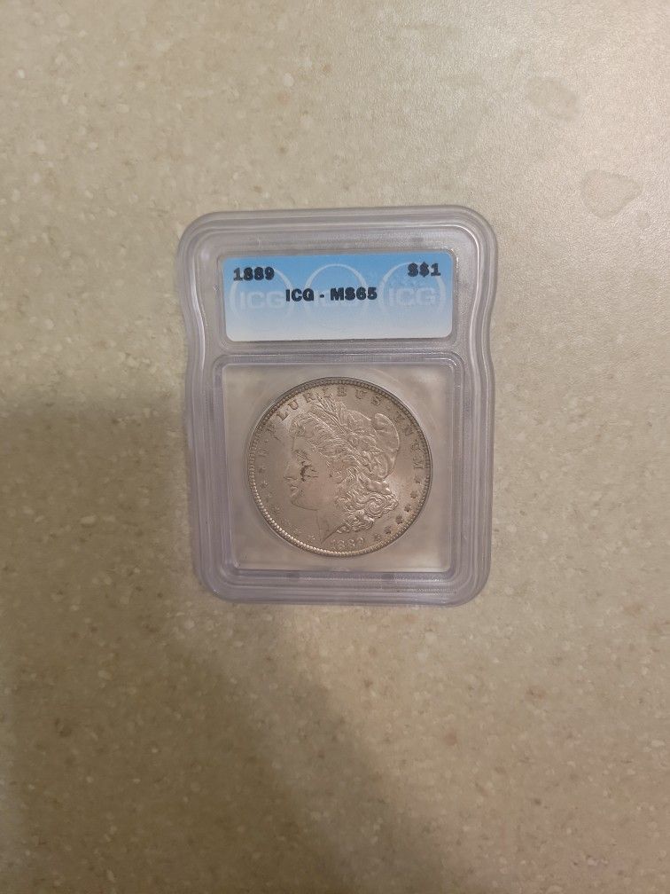 1889 Morgan Silver Dollar.  Graded 