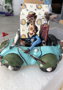 Giraffe in Golf Cart