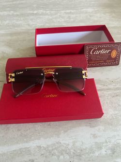 Gold and black Cartier glasses