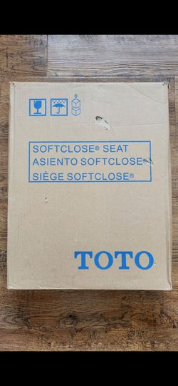 Brand New Brand New 
TOTO Plastic Bone Elongated Soft Close ToiletSeat